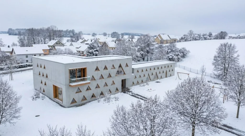 Dual-scale windows in a minimalist day-care interior.